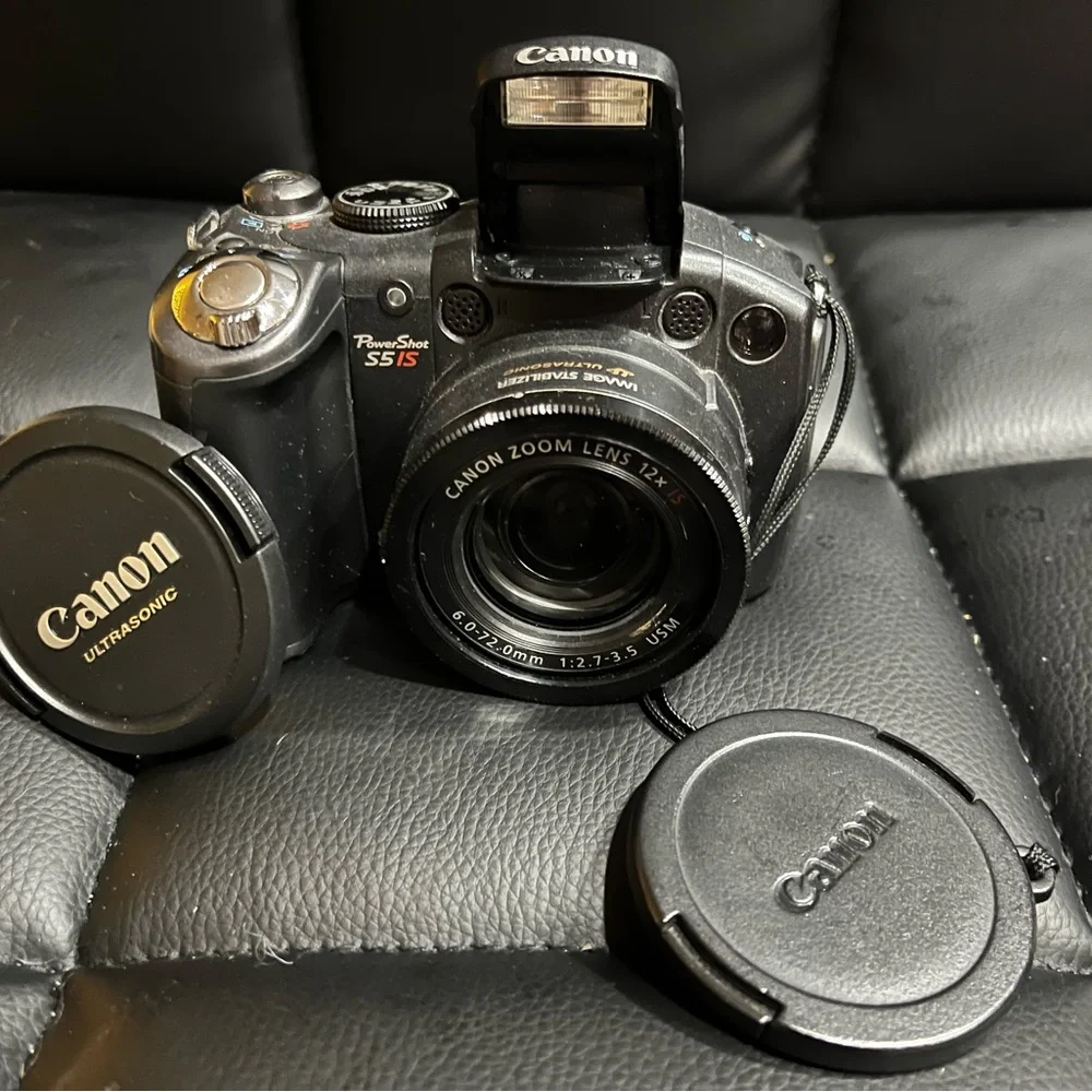 canon powershot s5 is with 2 lens covers and bag